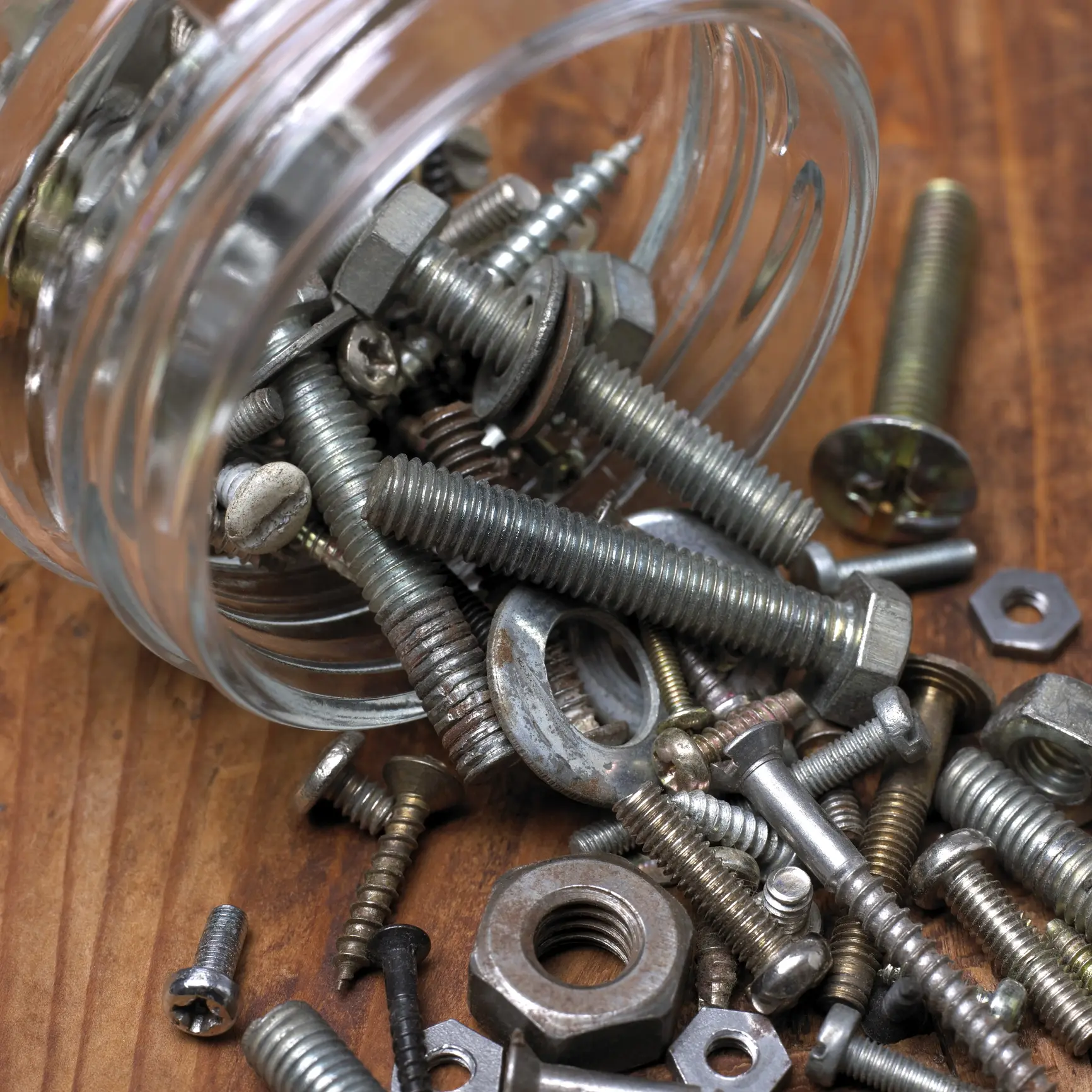 Assorted screws, nuts, and bolts scattered