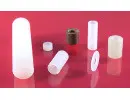 Plastic cylindrical components on red background