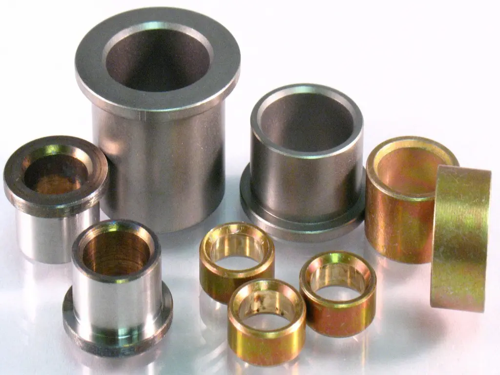 Assorted cylindrical metal bushings collection