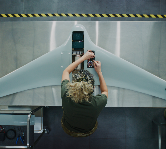 Person assembling drone components