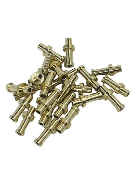 A pile of brass or metal mechanical parts or connectors.