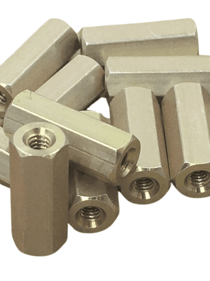 Close-up of brass hexagonal standoffs with threaded holes.